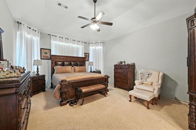 Bedroom with carpet and a ceiling fan | Image 12
