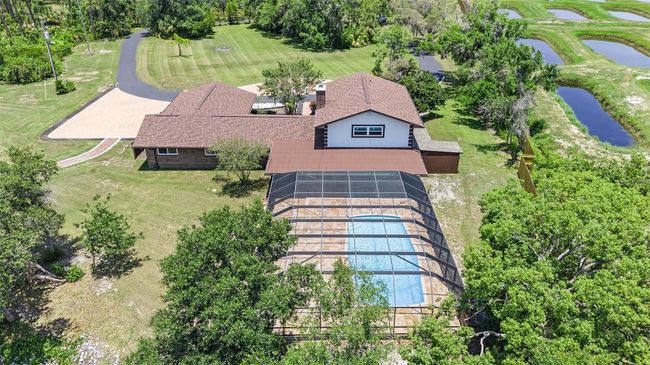aerial of pool and back yard | Image 32