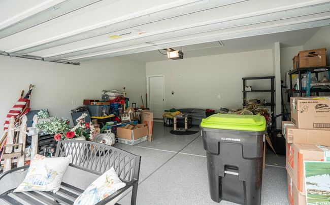Garage featuring a garage door opener | Image 37