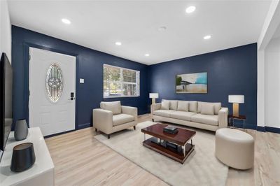 Living room featuring light hardwood / wood-style flooring | Image 1