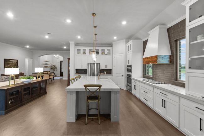 Chef's kitchen open to the family room creating the ideal space for gatherings | Image 18