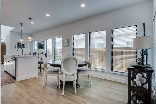 Dining space featuring light wood-type flooring and recessed lighting | Image 16
