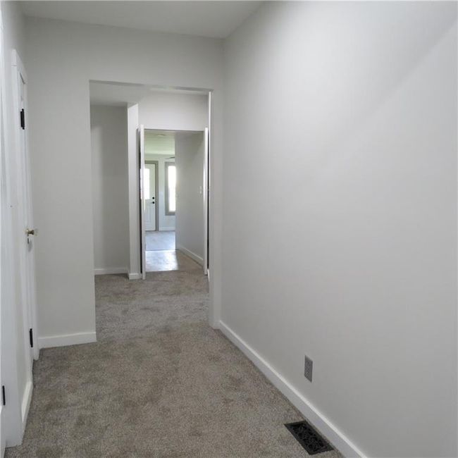 Hallway with new flooring and paint | Image 20