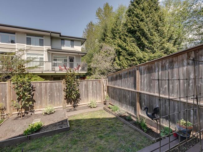View of yard with a fenced backyard and a vegetable garden | Image 33