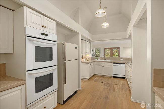 Featuring a double oven and extra sink in back right-hand corner. There is also a walk in pantry (along the backside). | Image 22