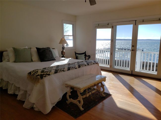 Primary 2nd fl suite 2 sided waterview and doors to waterside balcony | Image 25