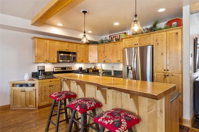 Live edge bar top and hardwood cabinets... | Image 7