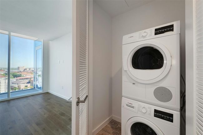 laundry area with stackable washer and dryer | Image 29