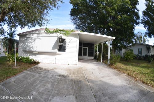 1056 Wren Cir, Barefoot Bay, FL, 32976-7511 | Card Image