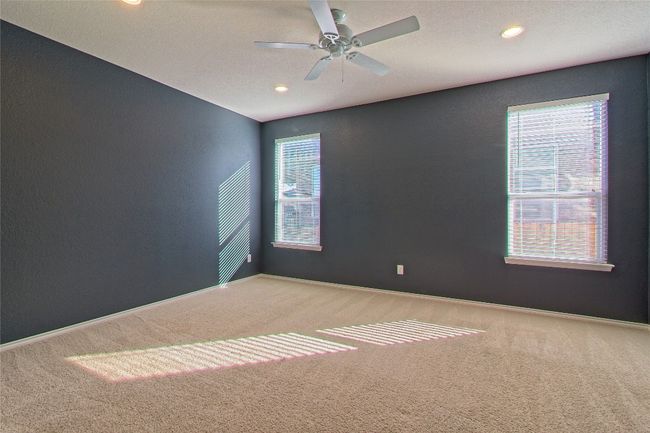 Carpeted spare room with a ceiling fan and recessed lighting | Image 19