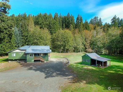 Level sunny location with 250ft of secluded river front on the Little Quilcene River. | Image 2