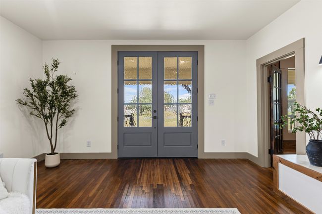 Foyer featuring french doors and dark wood finished floors | Image 8