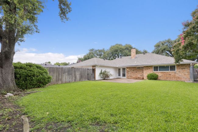 Large grassed backyard with dog run | Image 24