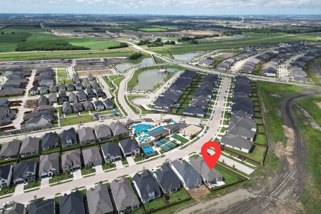 Aerial view of property's location with a nearby body of water and nearby suburban area | Image 29