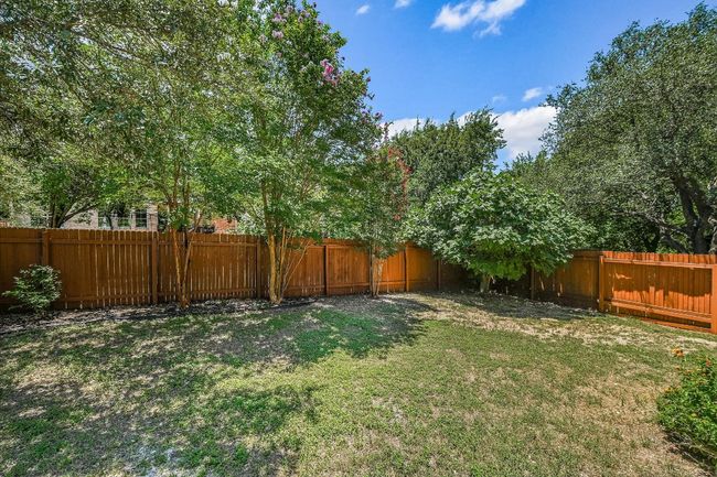 View of fenced backyard backing to Greenbelt/Trails | Image 20