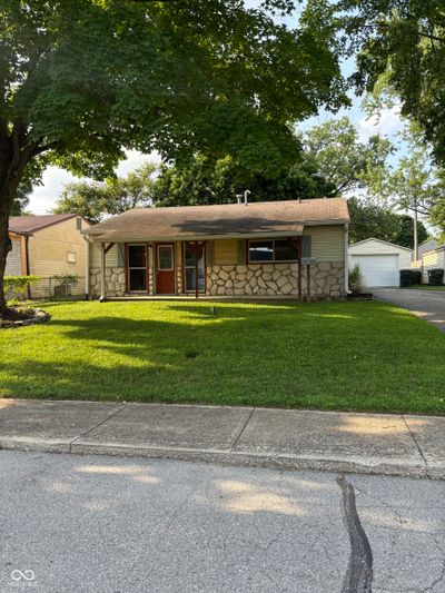 Front of home with mature trees | Image 1