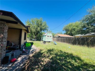 View of yard with a storage shed | Image 3