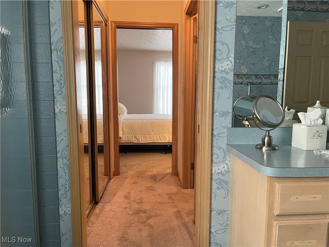 Hall way between Primary Bedroom and Bathroom | Image 21
