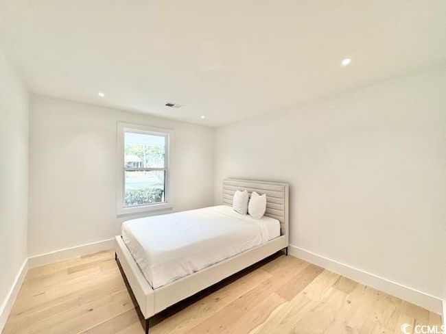 Bedroom with light wood-type flooring and recessed lighting | Image 23