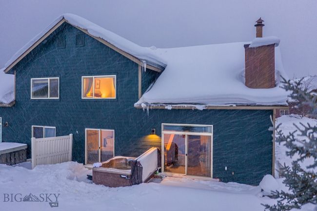 At twilight on a blustery winter's day, come home to your cozy chalet at 73 Starlight and celebrate life in the mountains of Montana | Image 30