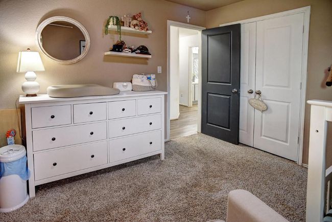 Bedroom with carpet floors and a closet | Image 24