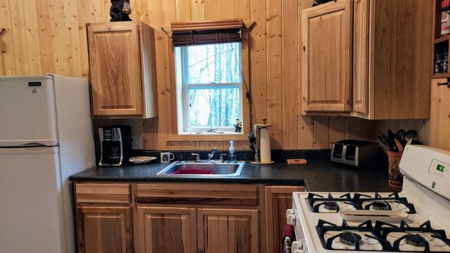 Kitchen window faces lake | Image 8