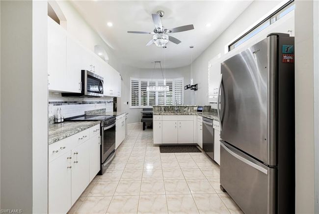 12802 Maiden Cane Ln, Condo with 3 bedrooms, 2 bathrooms and 2 parking in BONITA SPRINGS FL | Image 7