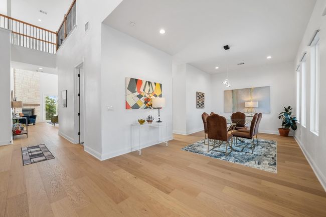 Elegant multiple dining areas showcase high-end chandeliers, recessed lighting, and seamless access to the gourmet kitchen—ideal for hosting family gatherings, social events, and business entertaining. | Image 12