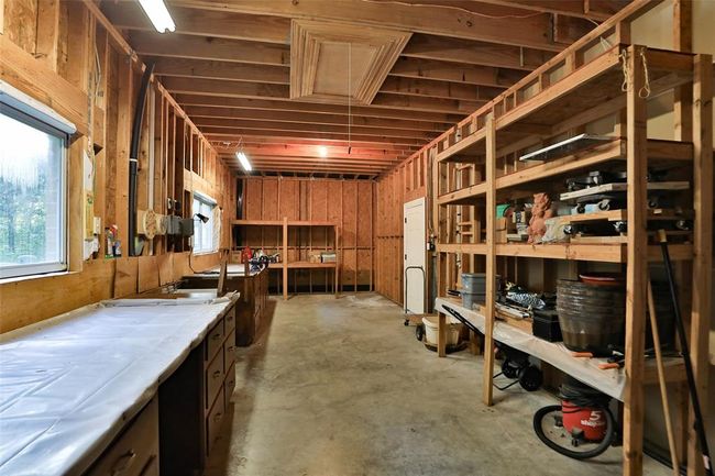 Another view of the workshop. The door leads to the 3 car garage. | Image 50