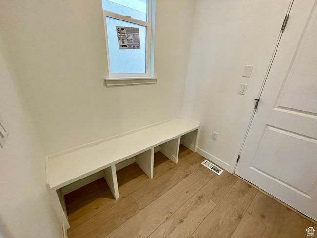 Mudroom with light wood-style flooring and baseboards | Image 8