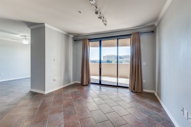 Living Room with walk-out primary balcony, ceramic tile and decorative lighting | Image 25