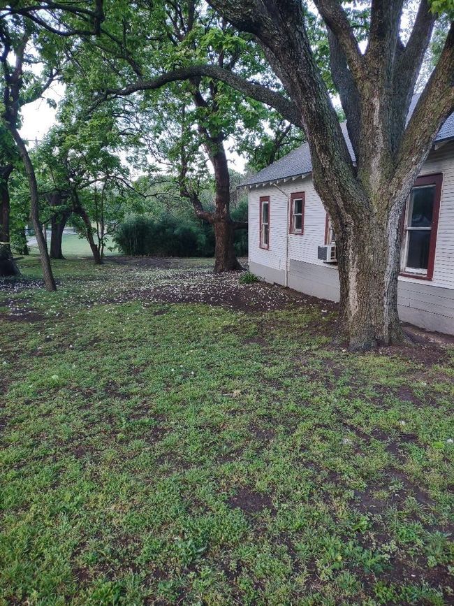 View of grassy yard featuring cooling unit | Image 29