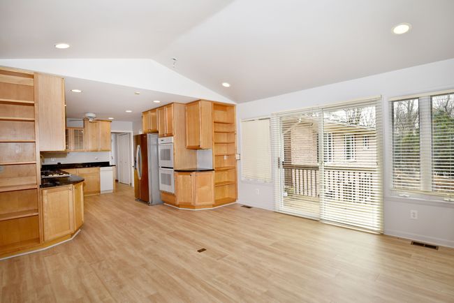another view of sitting area into kitchen | Image 21