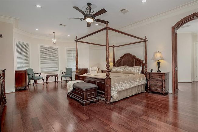 Secluded owner's retreat with sitting area and beautiful hardwood flooring | Image 19