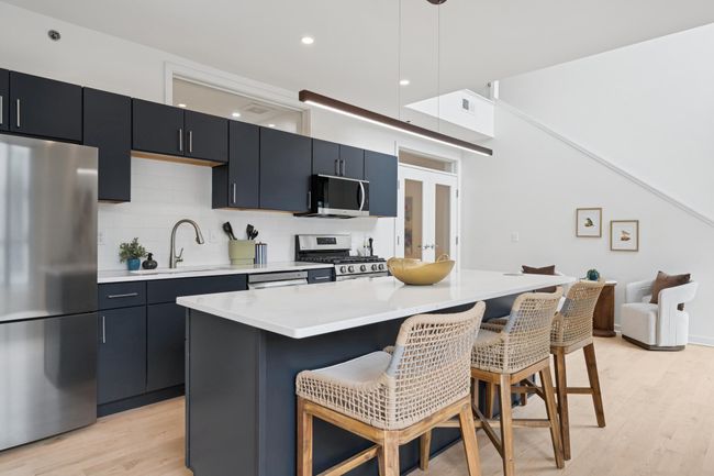The oversized center island isn’t just a showpiece—it’s functional, with built-in electrical for cooking, working, or gathering with ease. | Image 5