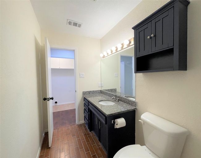 Half bath with wood finished floors and vanity | Image 20