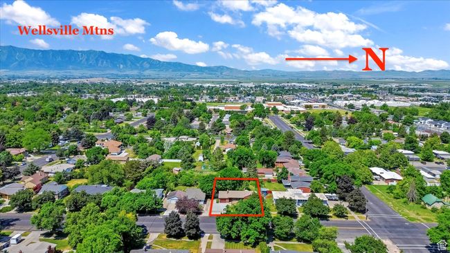 Aerial view of residential area with mountains and property parcel outlined | Image 49