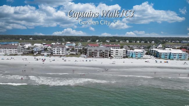 Bird's eye view of waterfront with a beach | Image 4