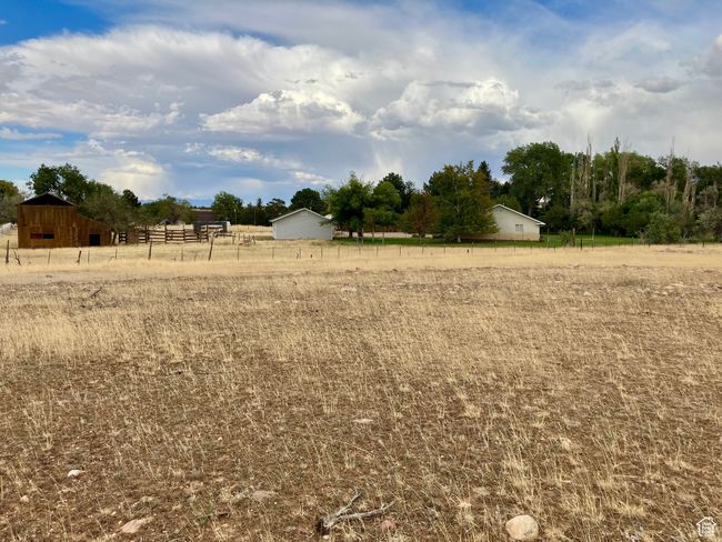 View of yard featuring fence and a rural view | Image 80