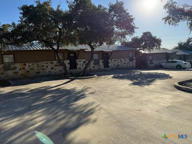 Each apartment has own entrance and back patio. Another view of apartment community. | Image 11