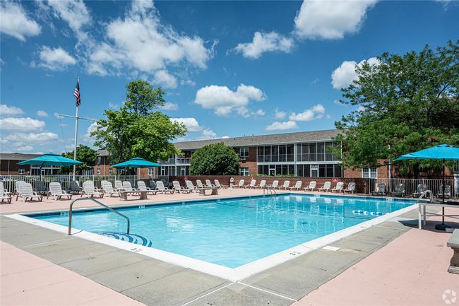 Community pool with a patio | Image 9