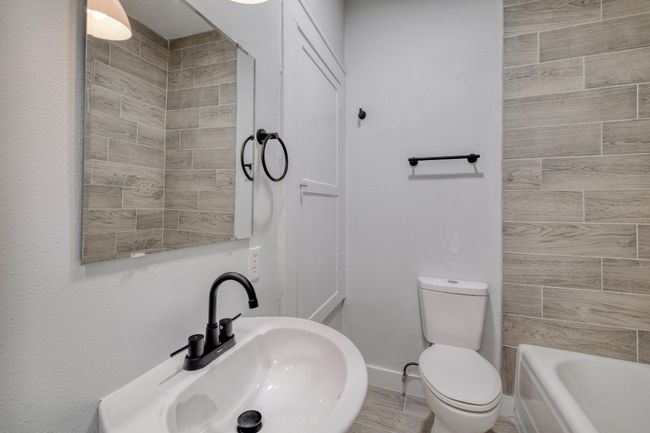 Full bathroom with a sink and toilet | Image 36