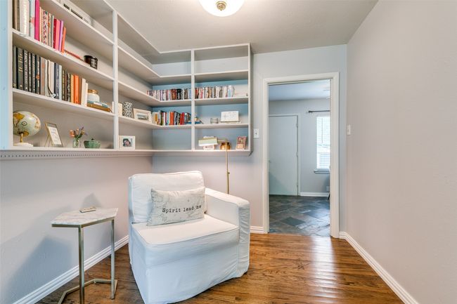 Sitting room or dining room with wood floors and built-ins | Image 8