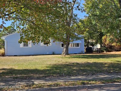 Right side view of home and large property | Image 3