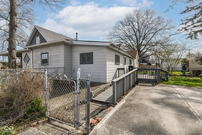 Wood ramp on side of house to wooden deck | Image 28