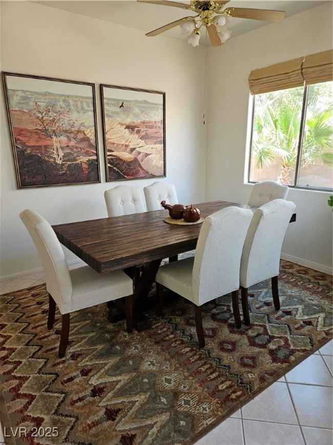 Tiled dining area featuring a ceiling fan | Image 15