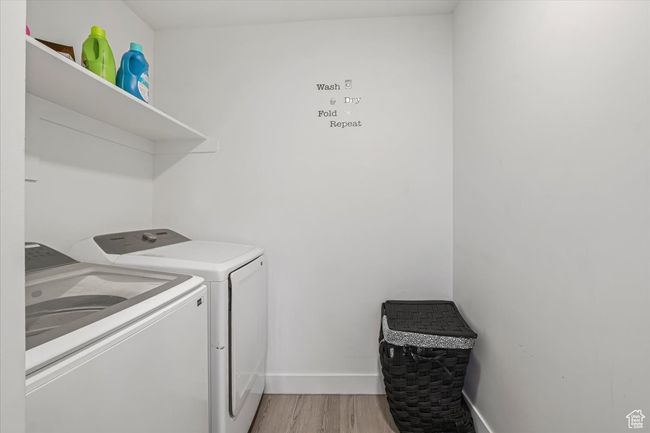 Clothes washing area featuring washer and dryer | Image 20