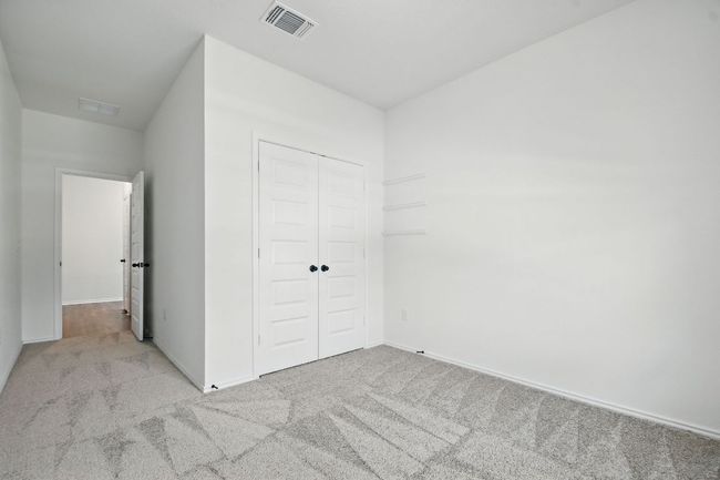 Unfurnished bedroom with carpet floors and a closet | Image 14