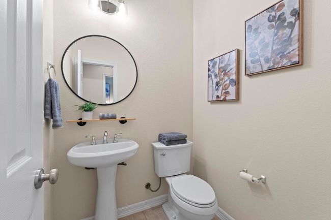 Bathroom featuring toilet and baseboards | Image 34