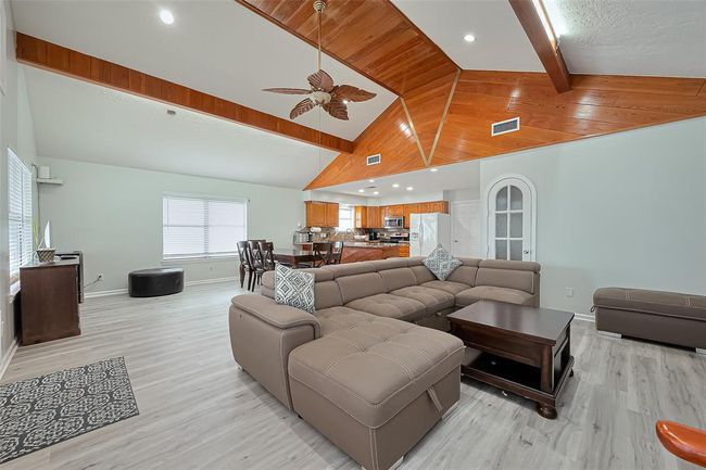 Open-plan living area offering a functional and inviting space for gatherings. | Image 7
